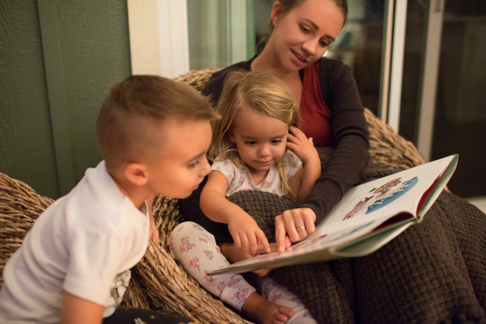 Mom reading to kids